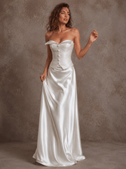 Elegant ivory satin corset wedding dress with ruched bodice and flowing train