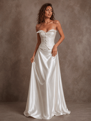 Ivory satin corset wedding dress with ruched bodice and flowing train