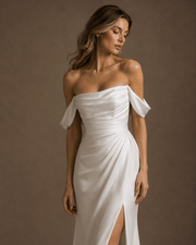 Ivory draped off-shoulder satin evening gown with sculpted waist and thigh slit