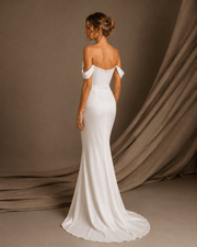 Ivory draped off-shoulder satin evening gown with sculpted waist and thigh slit