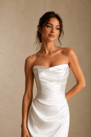 Elegant ivory satin draped wedding guest dress with minimalist maxi gown silhouette
