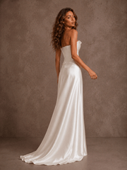 Elegant ivory satin corset wedding dress with ruched bodice and flowing train
