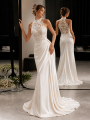 Elegant ivory lace halter dress with sheer bodice and draped train for weddings