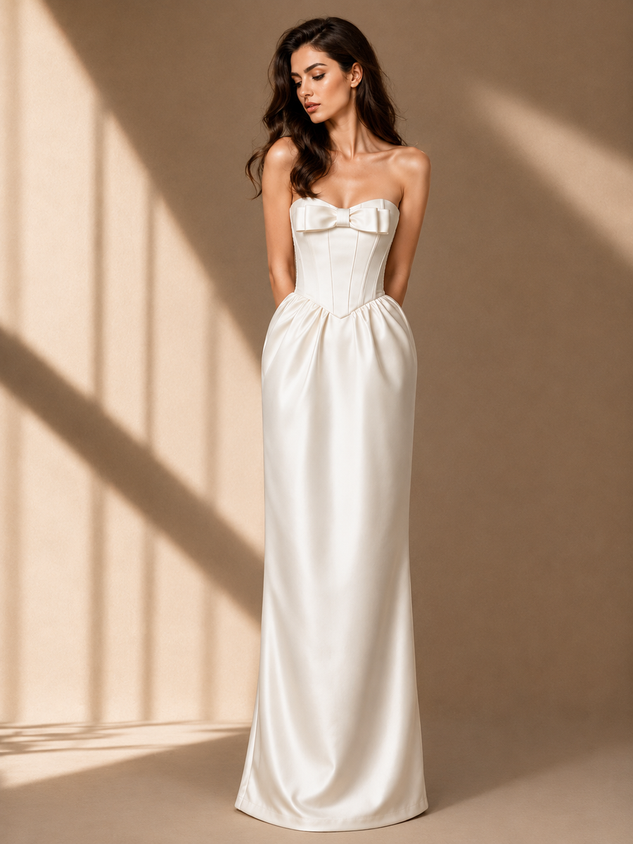 Elegant ivory satin corset strapless maxi evening gown with sculpted bodice and bow detail