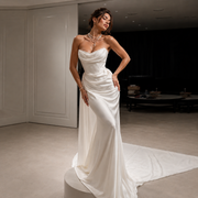Elegant Celestial Drape Back wedding guest dress in flowing satin with minimalist strapless design