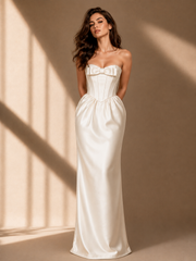 Ivory satin corset evening gown with strapless bow and floor-length hem
