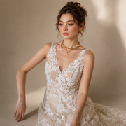 Ivory floral lace wedding guest dress with nude tulle, deep V neckline, and sheer lace skirt