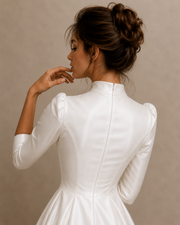 Elegant Ivory Whisper Satin bridal gown with high collar and cathedral train