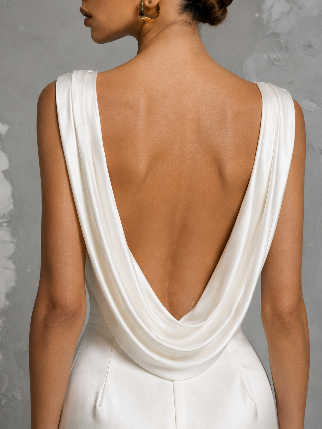 Ivory satin draped V neck wedding dress with open cowl back and thigh-high slit