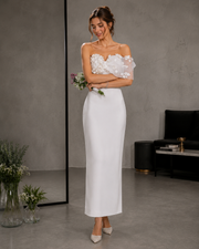Ivory satin strapless off shoulder wedding dress with 3D floral appliqués and minimalist sheath silhouette