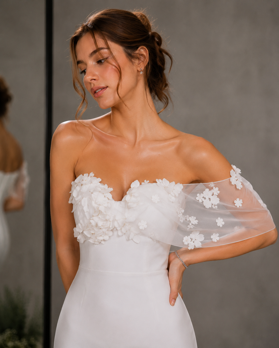 Ivory satin strapless off shoulder wedding dress with 3D floral appliqués and minimalist sheath silhouette