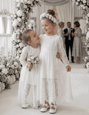 2-4 years girl wearing long white lace fairy dress with vintage flower girl design and puff sleeves