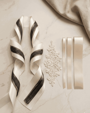 Ivory and charcoal satin ribbon set with layered widths for elegant wedding and gift styling