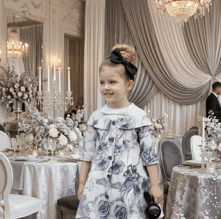 Young girl wearing grey floral off-shoulder dress with A-line silhouette and subtle sheen