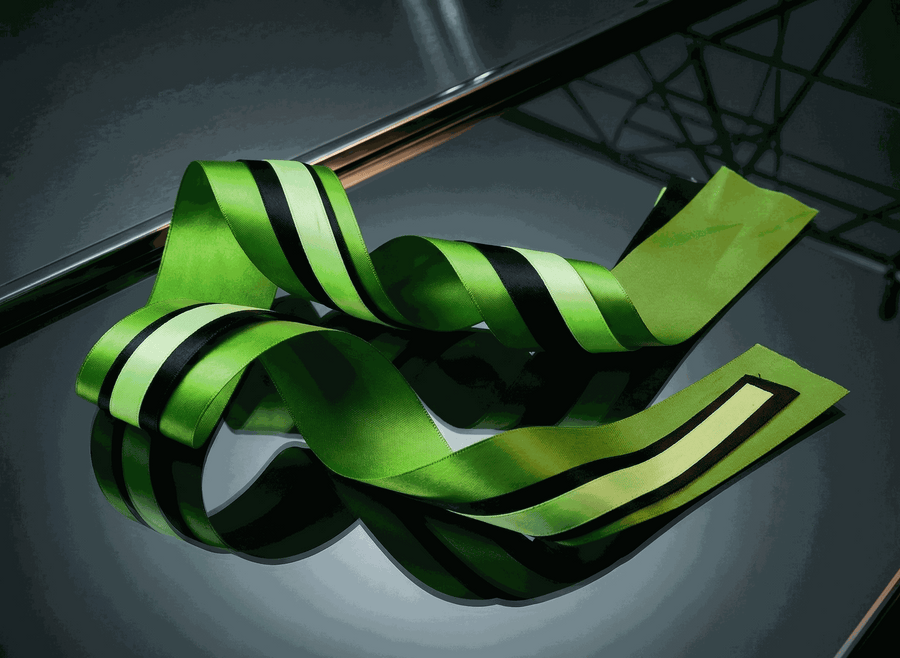 Emerald green satin ribbon set with three complementary textured ribbons for styling and gift wrapping