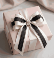 Ivory and charcoal satin ribbons styled for elegant wedding and gift decoration