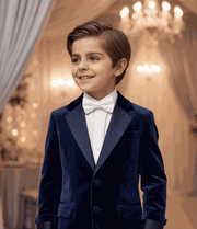 Boy wearing navy velvet blazer, tailored fit, for special occasions and everyday elegance ages 6-9