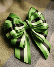 Emerald green satin ribbon set with three complementary textured ribbons for elegant styling and gift wrapping