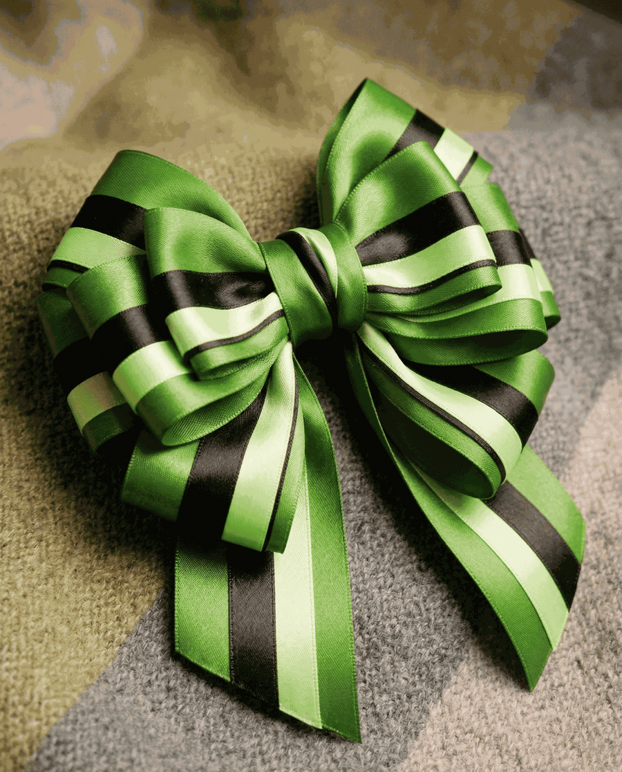 Emerald green satin ribbon set with three complementary textured ribbons for elegant styling and gift wrapping