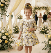Girl wearing a grey floral off-shoulder dress with subtle sheen and A-line silhouette