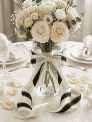 Ivory and charcoal satin ribbons styled as elegant bows for weddings and gifts