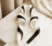 Ivory and charcoal satin ribbon set with layered widths for elegant weddings and gift styling