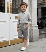 Boys plaid flannel shirt in classic check pattern with long sleeves and button-down front for casual everyday wear