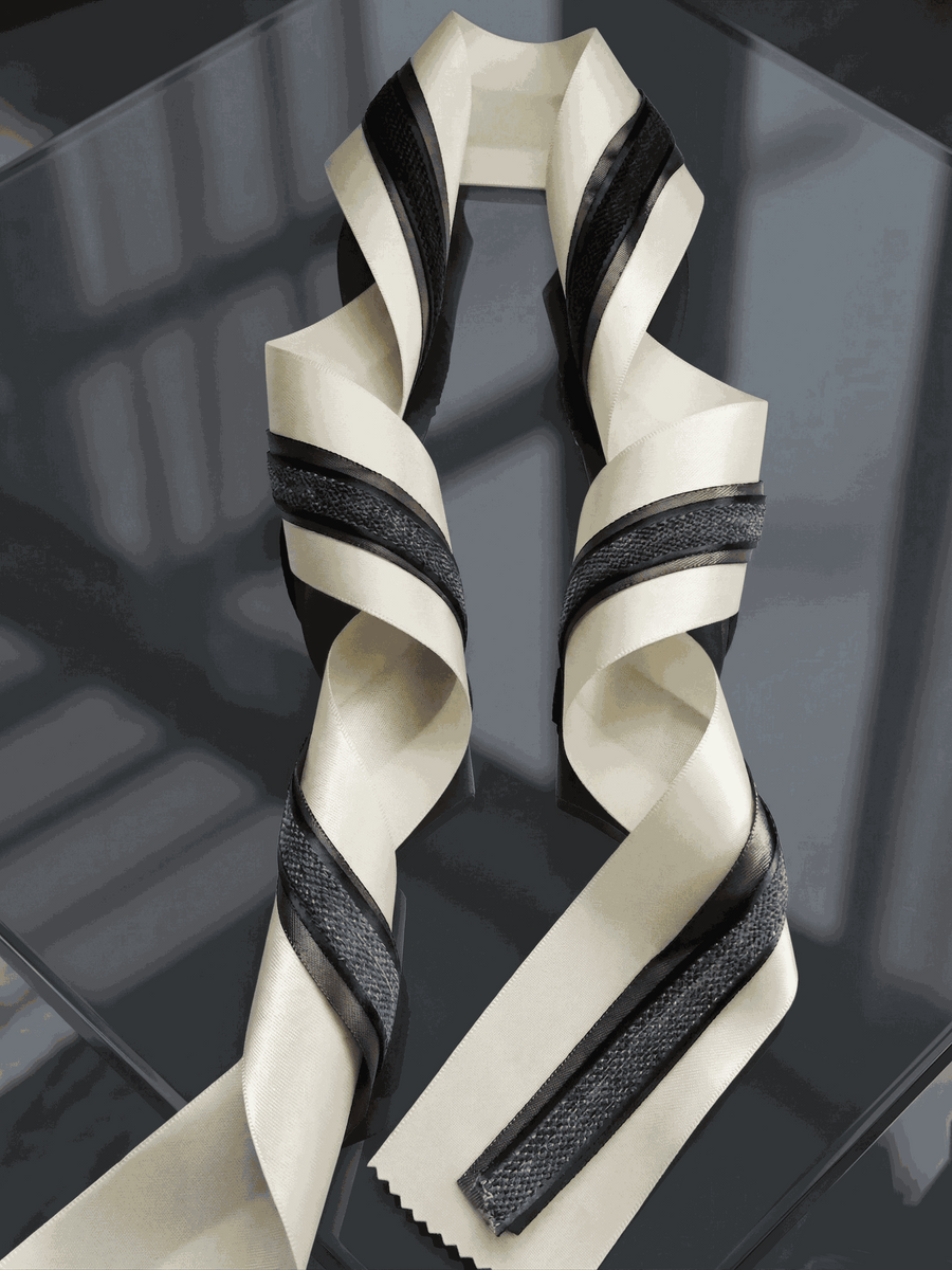 Ivory and charcoal satin ribbons set with layered widths for elegant wedding and gift styling