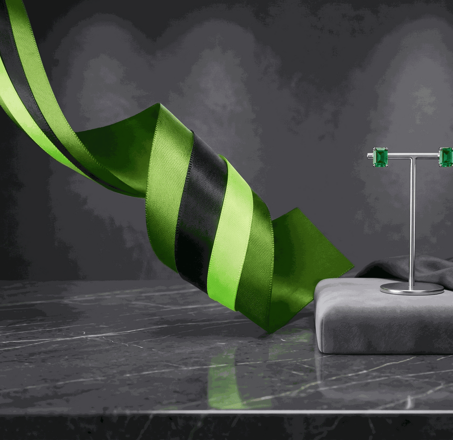 Set of three emerald green satin ribbons with varied textures and widths for elegant styling and gift wrapping