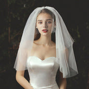 Ivory bow bridal veil made of soft chiffon tulle with elegant knot accent for wedding headpiece