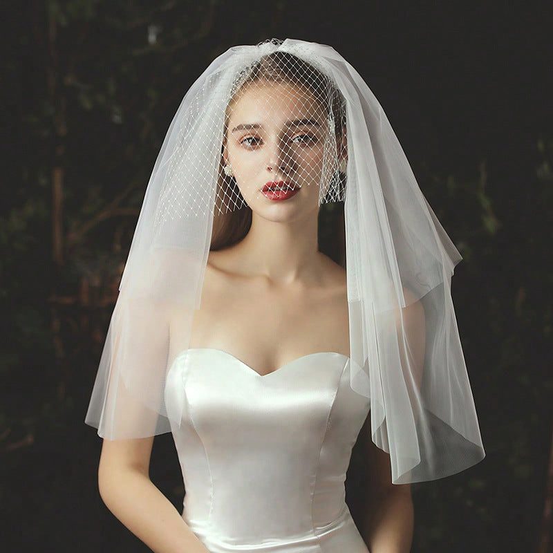 Ivory bow bridal veil made of soft chiffon tulle with elegant knot accent for wedding headpiece