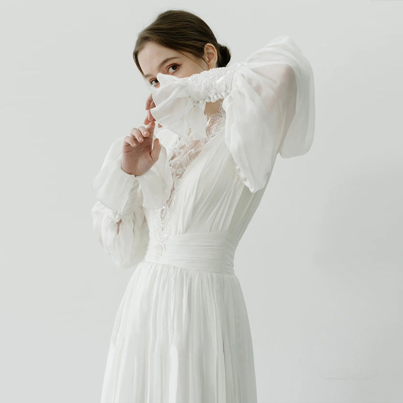 Vintage celestial lace formal wedding guest dress with high neck and chiffon bishop sleeves