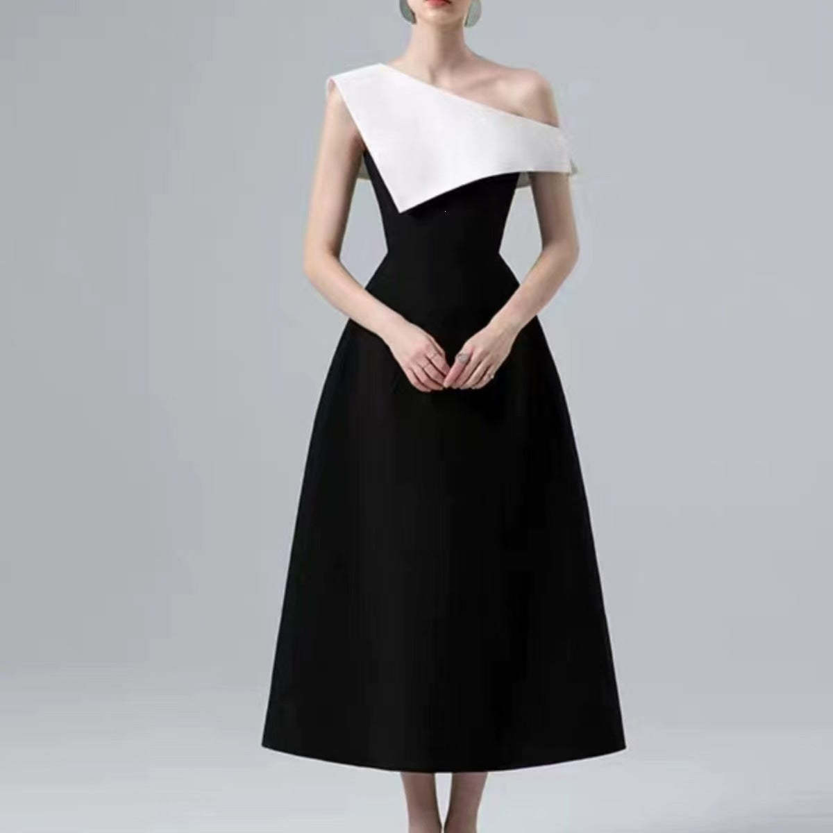 Black and White Midi Dress — A Sculptural Asymmetric Neckline with an A-Line Skirt