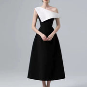 Black and White Midi Dress — A Sculptural Asymmetric Neckline with an A-Line Skirt