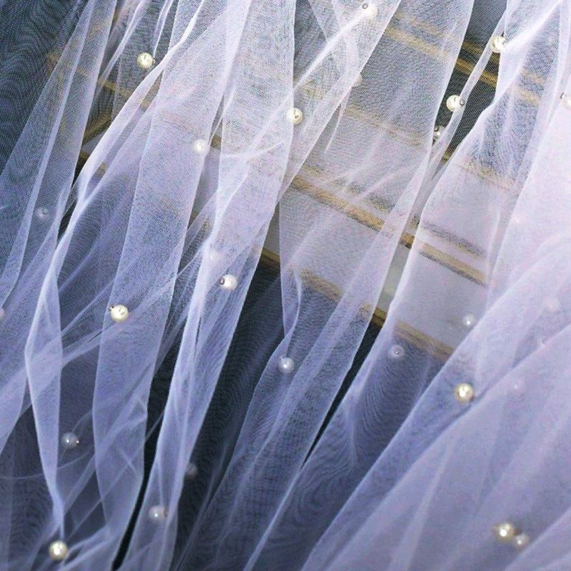 Beaded mid-length bridal veil made of soft lace tulle, lightweight and elegant for weddings