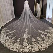 Cathedral lace bridal veil made of embroidered tulle with a long wedding train and delicate chiffon fabric