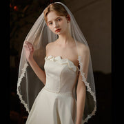 Sheer lace waist-length bridal veil made of lightweight chiffon tulle, single-layer wedding headpiece with elegant minimalist design