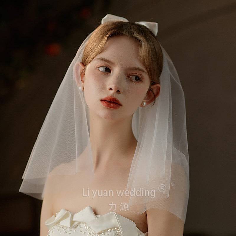 Ivory Bow Bridal Veil made of soft chiffon tulle with elegant knot accent for weddings
