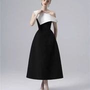 Black and White Midi Dress — A Sculptural Asymmetric Neckline with an A-Line Skirt