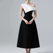 Black and White Midi Dress — A Sculptural Asymmetric Neckline with an A-Line Skirt