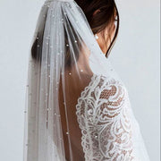 Beaded mid-length bridal veil in soft lace tulle, lightweight and elegant for weddings and travel
