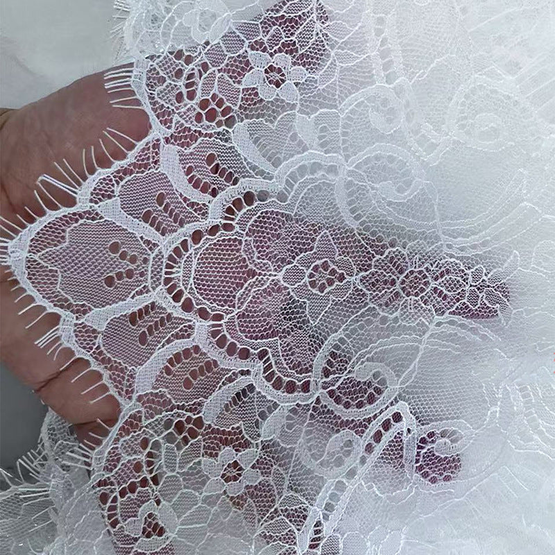Black and white eyelash lace cathedral bridal veil with long wedding train headpiece on soft chiffon tulle background