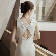Floral Appliqué Mini Dress — Sculptural Blooms with a Cut-Out Back