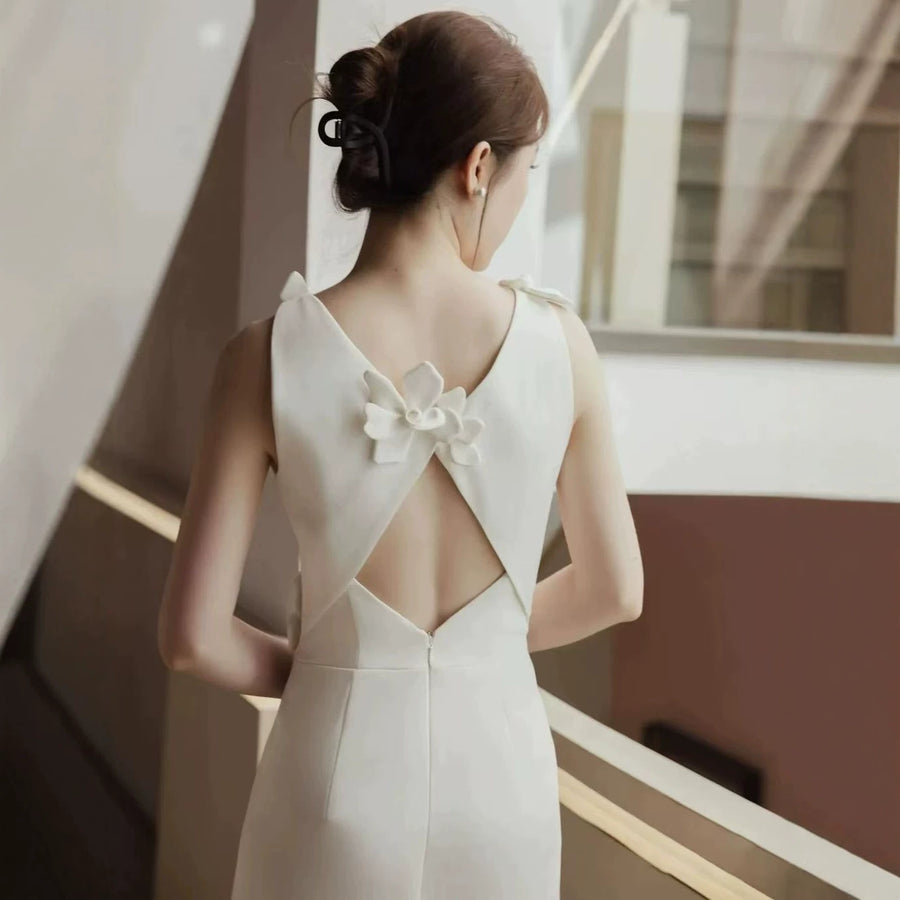 Floral Appliqué Mini Dress — Sculptural Blooms with a Cut-Out Back