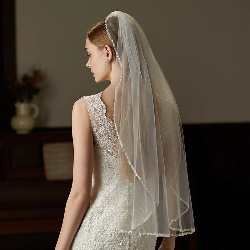 Beaded hair comb with mid-length elegant tulle bridal veil handcrafted from soft chiffon