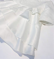 White vintage flower girl dress with jacquard satin bodice and layered tulle skirt for weddings and special occasions