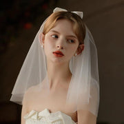 Ivory Bow Bridal Veil made of soft chiffon tulle with elegant knot accent