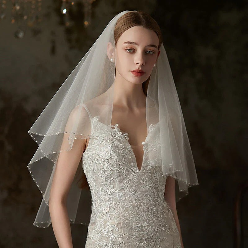 Double-layer soft tulle lace trim bridal veil with hair comb on white background