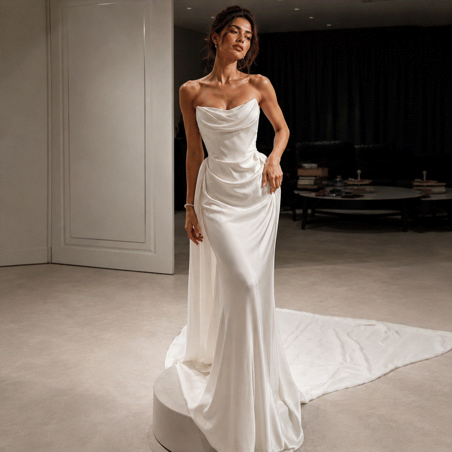 Elegant Celestial Drape Back strapless satin wedding guest dress with flowing silhouette