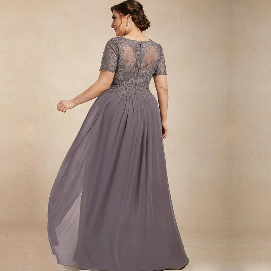 Chiffon long evening gown in gray with lace short sleeves and sheer embroidered back, flowing skirt and elegant design.